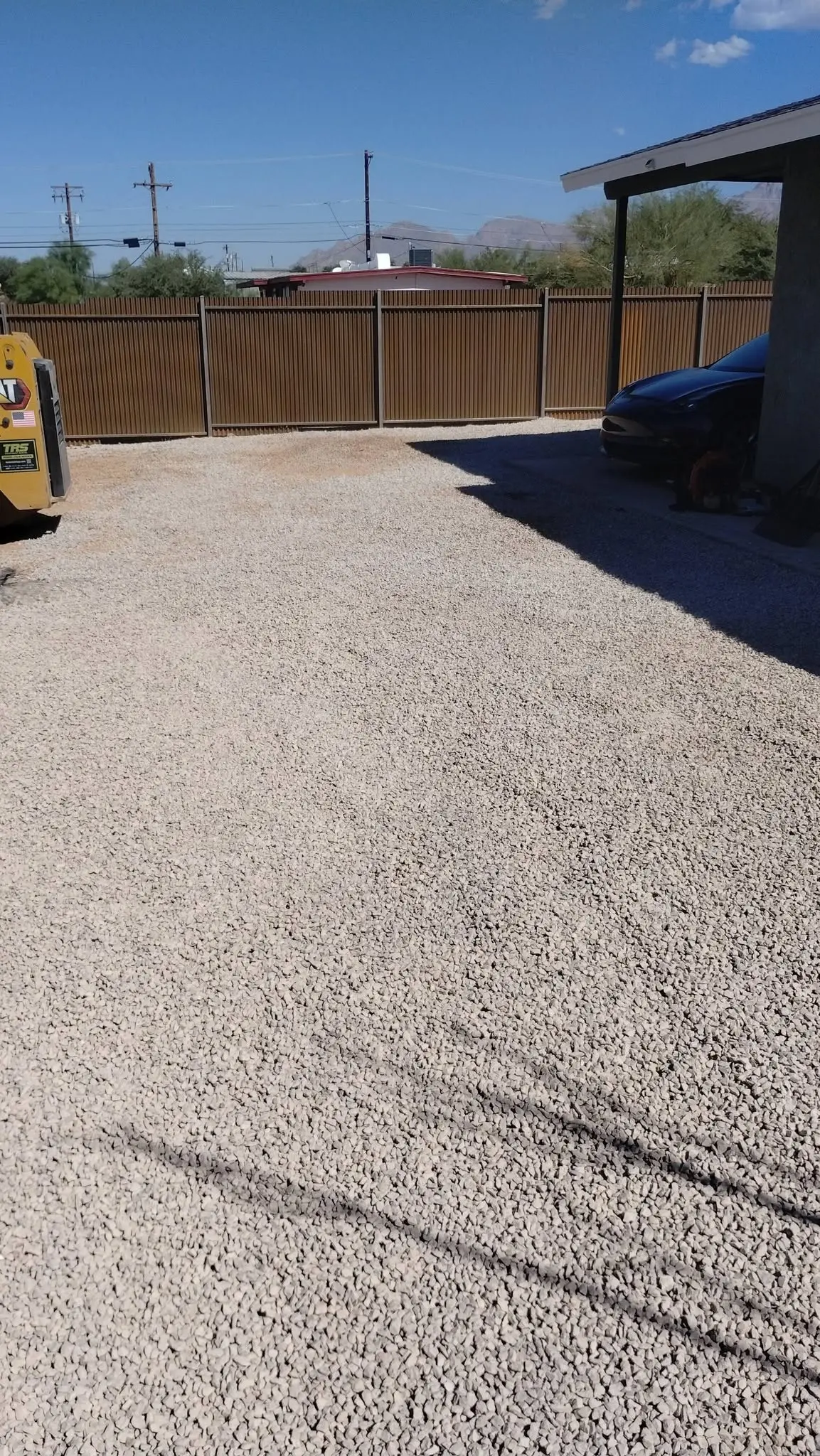 Rock landscape maintenance service on an Arizona residential property