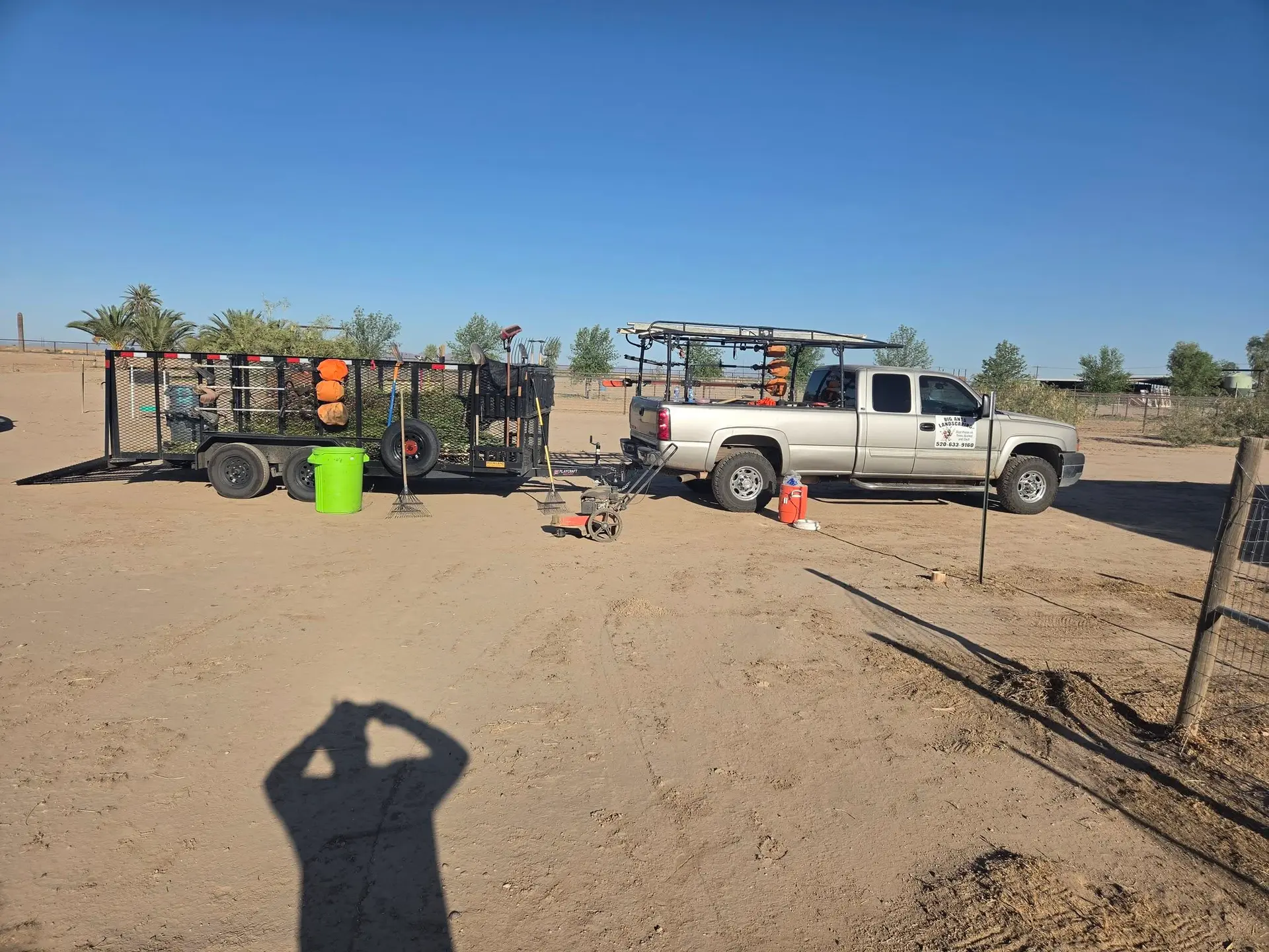 The Big Ants Landscaping truck and equipment trailer loaded for a maintenance job in Marana, Arizona